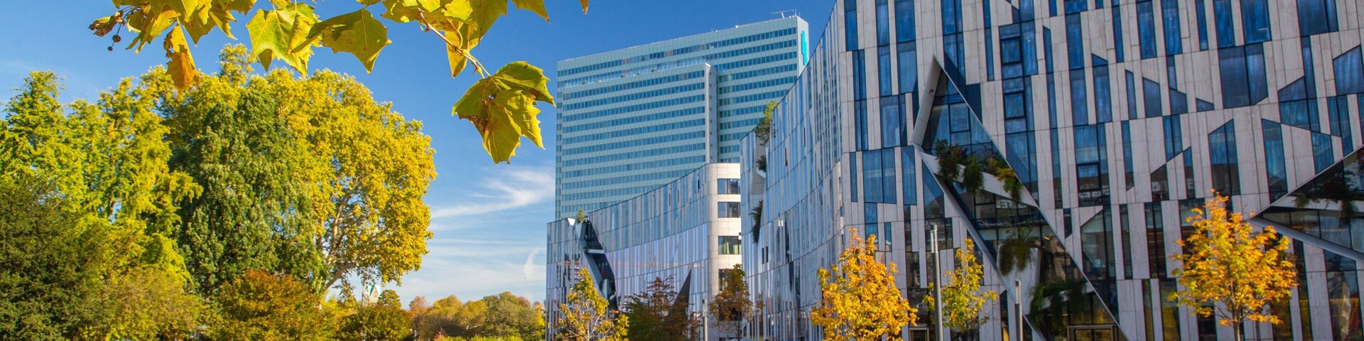 Hofgarten which includes modern architecture and a river or creek