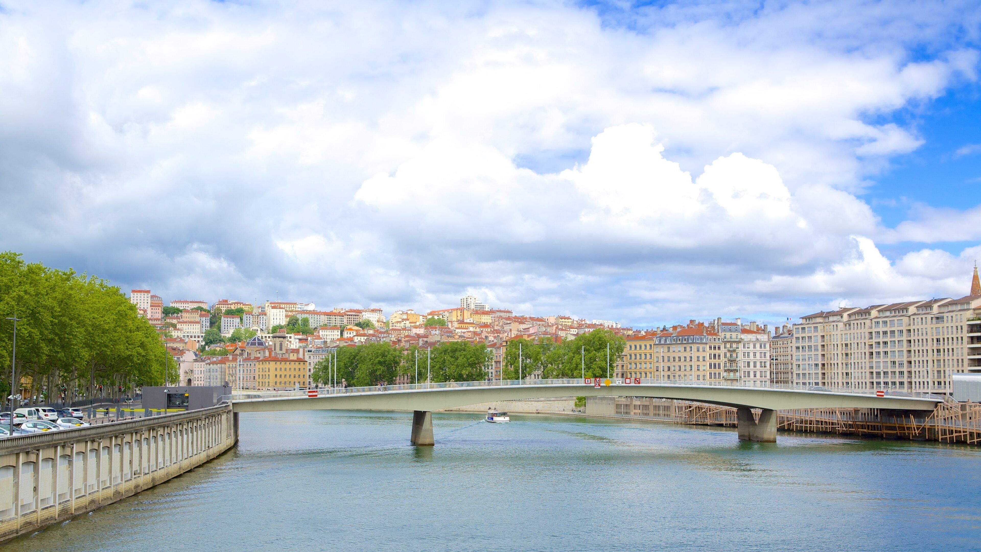 Lyon featuring a bridge, a city and a river or creek