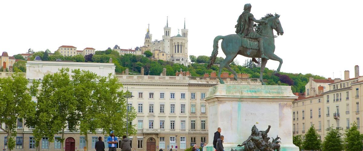 Lyon showing a square or plaza and a statue or sculpture