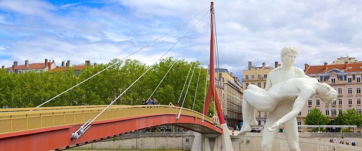 Bellecour Square showing a statue or sculpture, a river or creek and a bridge