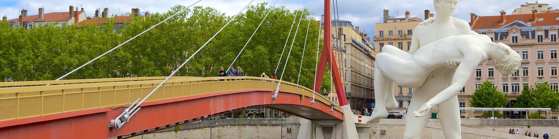 Bellecour Square showing a statue or sculpture, a bridge and a river or creek