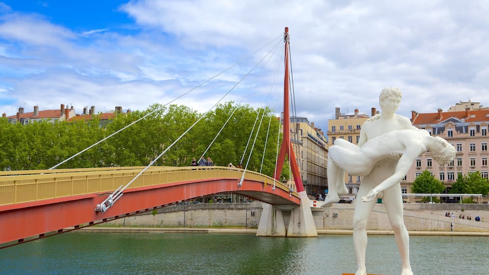 Bellecour Square showing a statue or sculpture, a bridge and a river or creek
