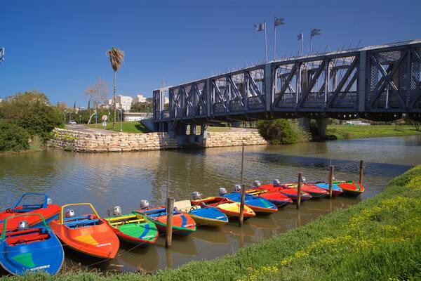 Yarkon Park which includes a bridge and a river or creek