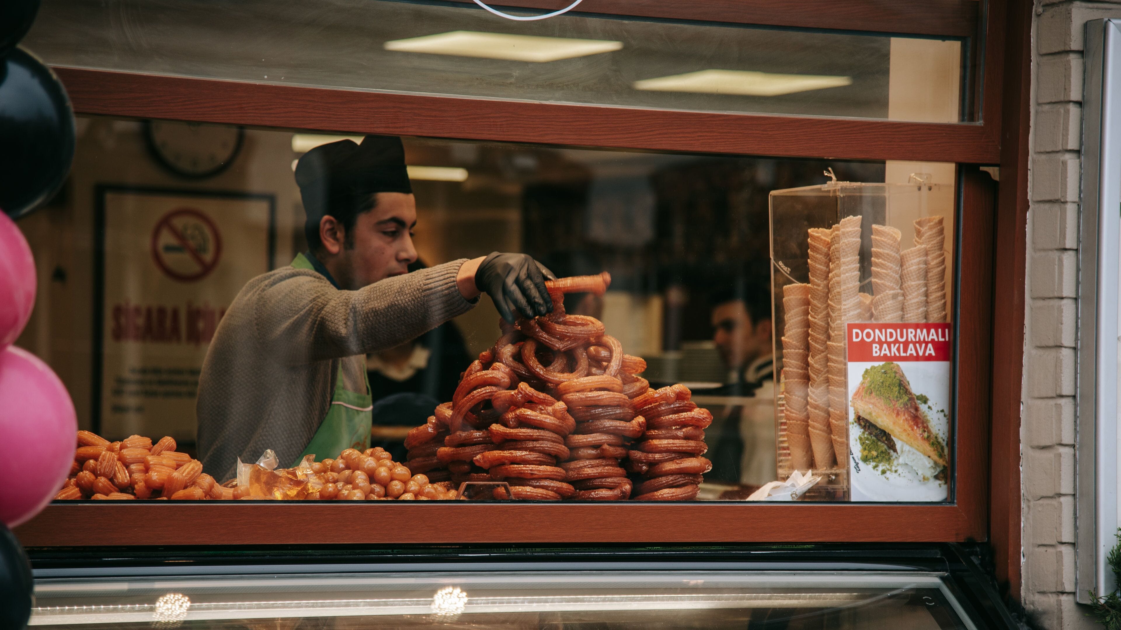 Taksim Square featuring food and markets as well as an individual male