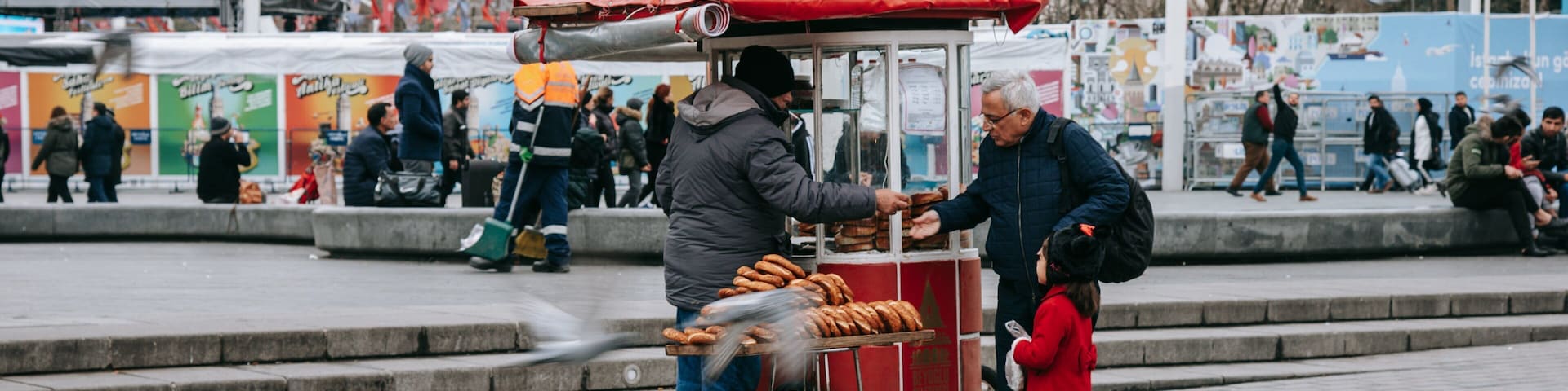 Taksim Square which includes street scenes and markets as well as a family
