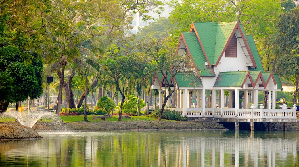 Lumpini Park which includes a house, a lake or waterhole and landscape views
