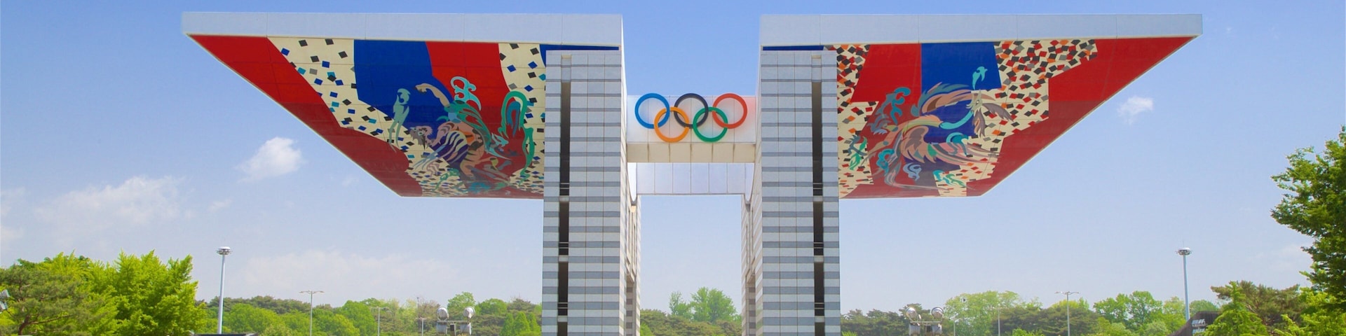Olympic Park showing signage, heritage elements and a garden