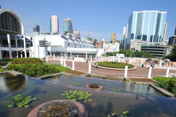 Kowloon Park which includes a city, a park and a pond