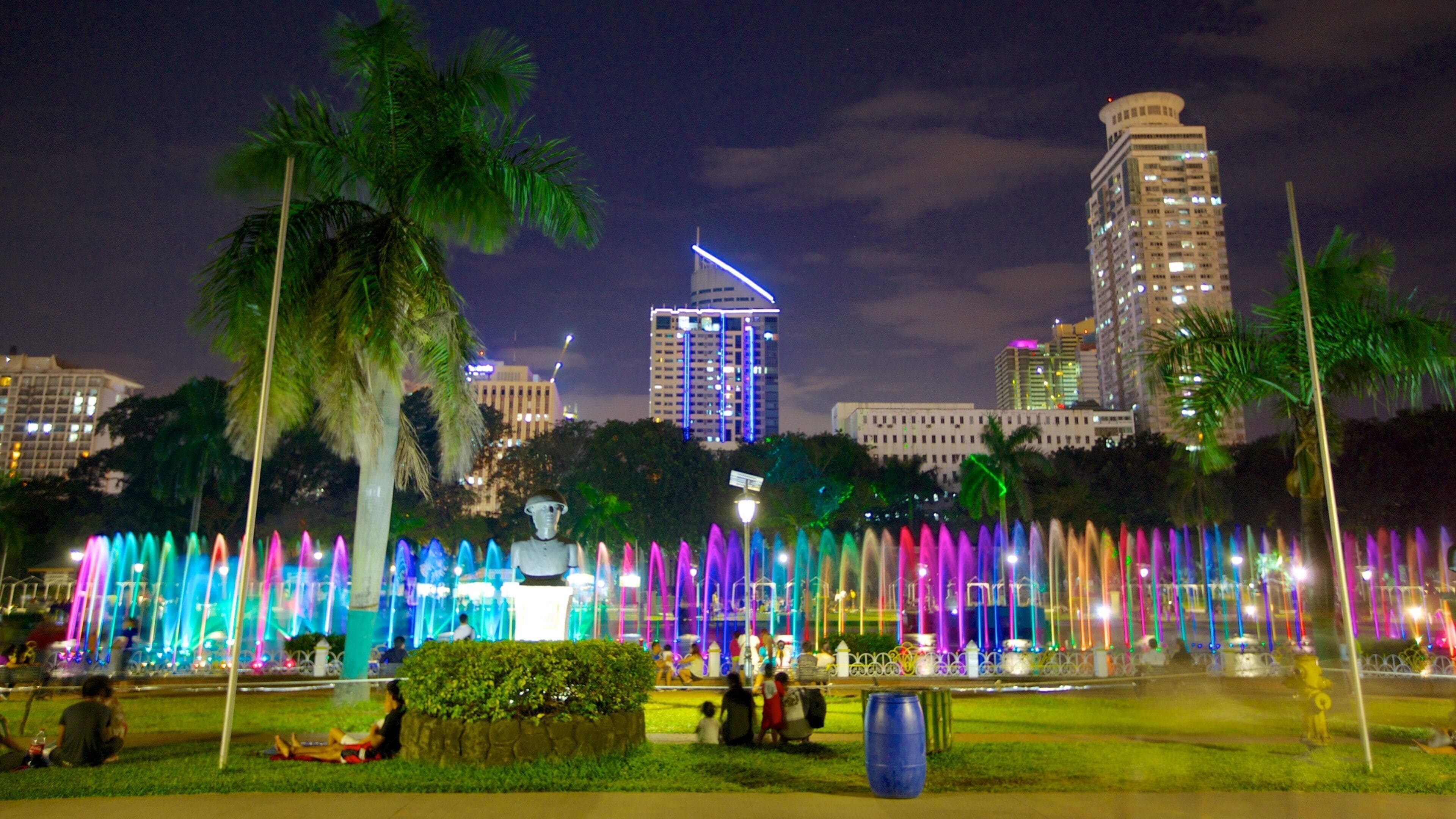 Rizal Park which includes night scenes, a garden and a fountain