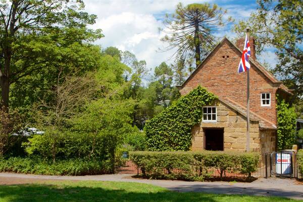 Fitzroy Gardens which includes a park, heritage architecture and a house