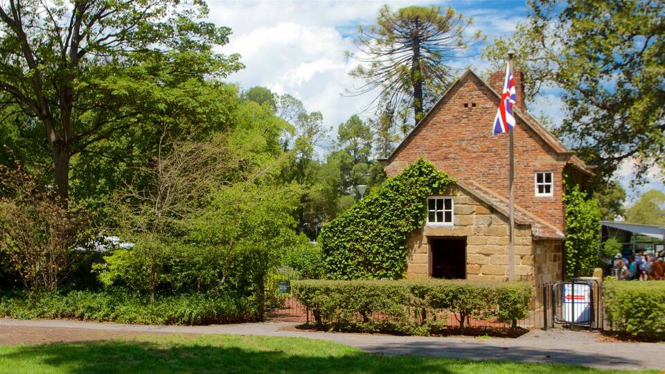 Fitzroy Gardens which includes a park, heritage architecture and a house