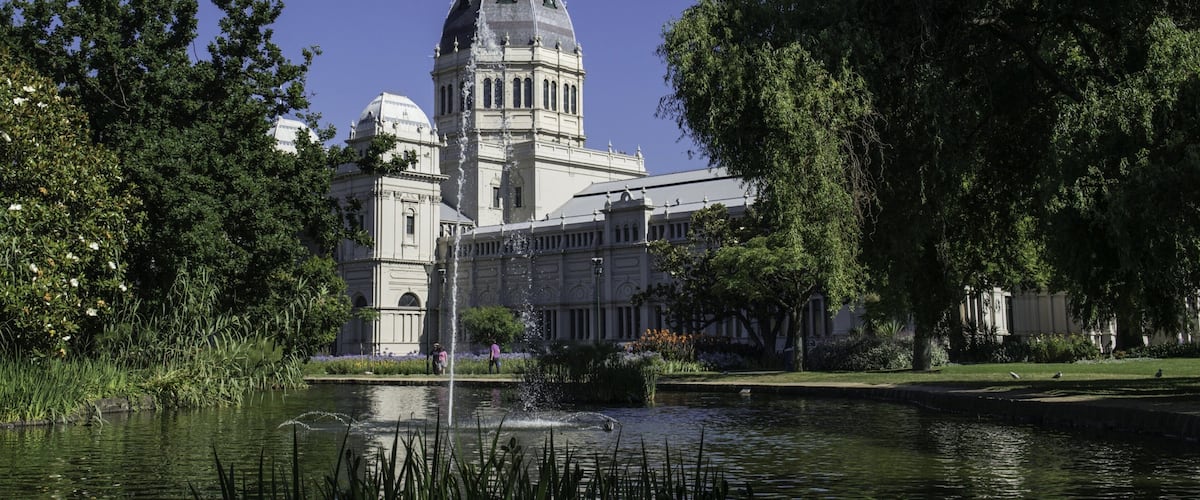 Carlton Gardens featuring heritage architecture, a river or creek and a pond
