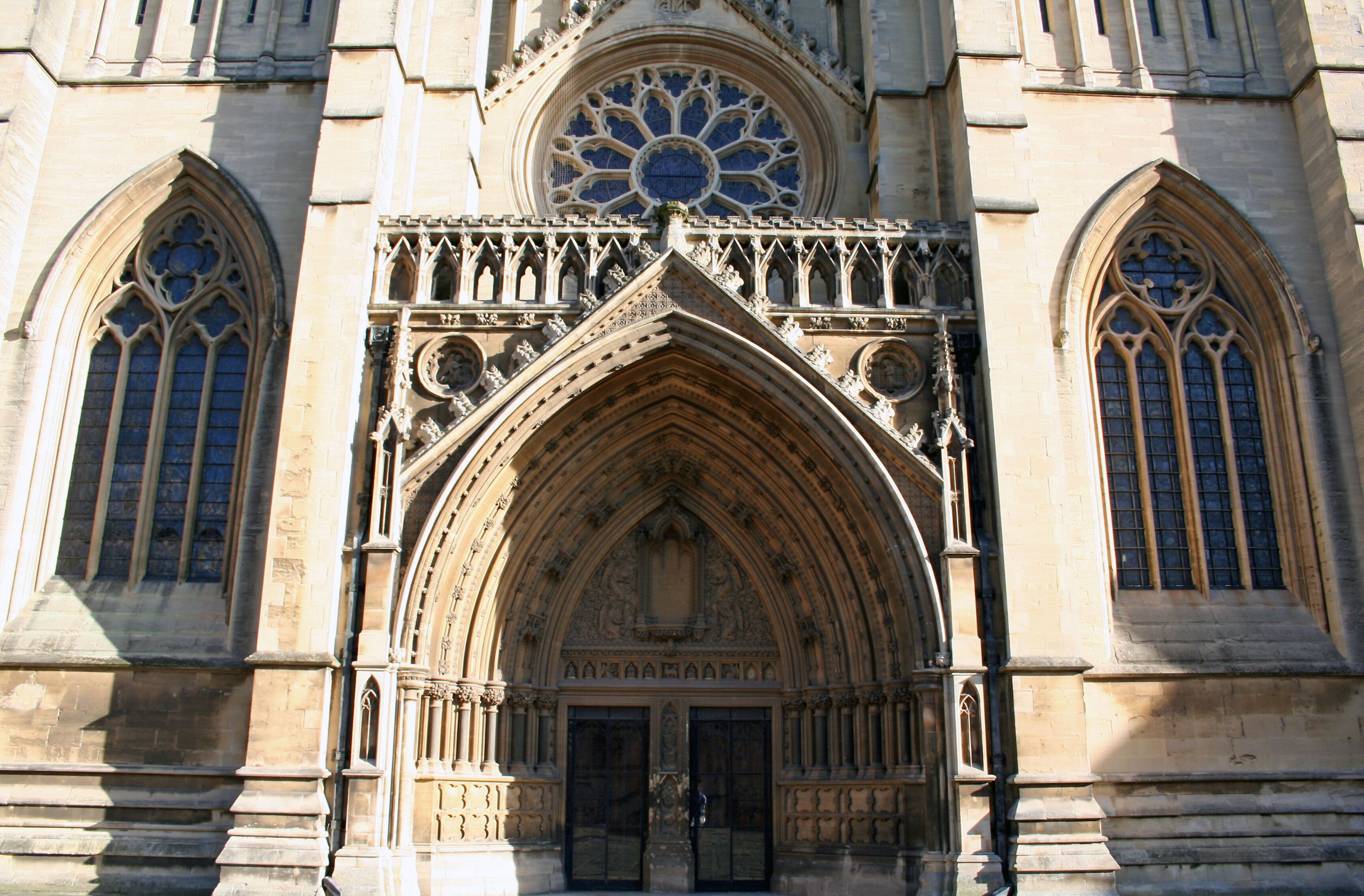 A historic cathedral with intricate Gothic architecture, large rose window, and pointed arches.