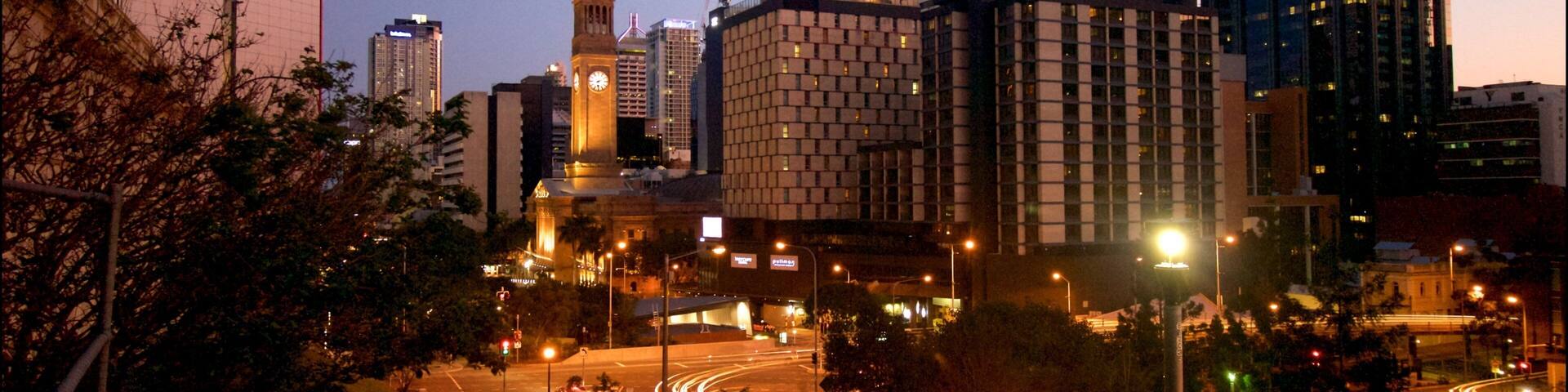King George Square which includes night scenes and a city