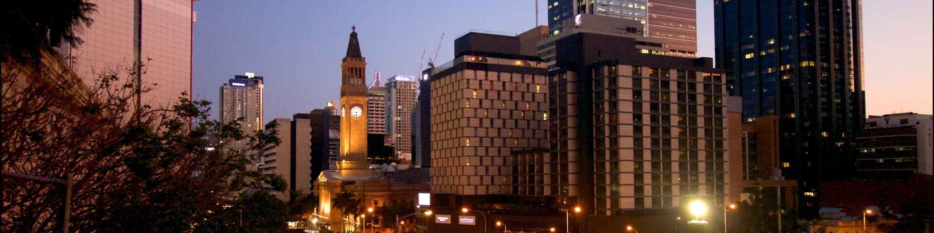 King George Square which includes night scenes and a city