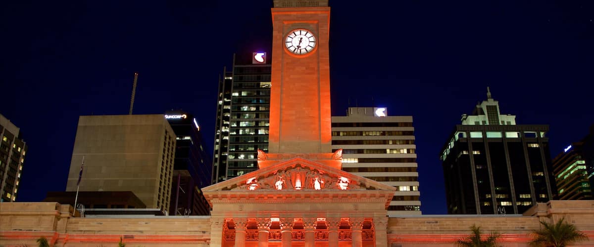 King George Square showing night scenes and a city