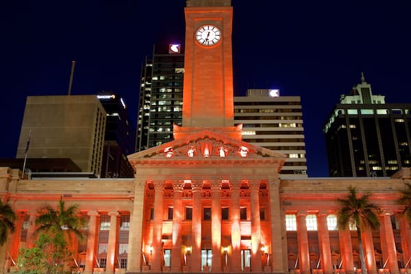King George Square showing night scenes and a city