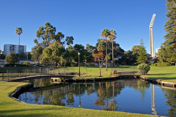Queens Gardens featuring a park and a pond