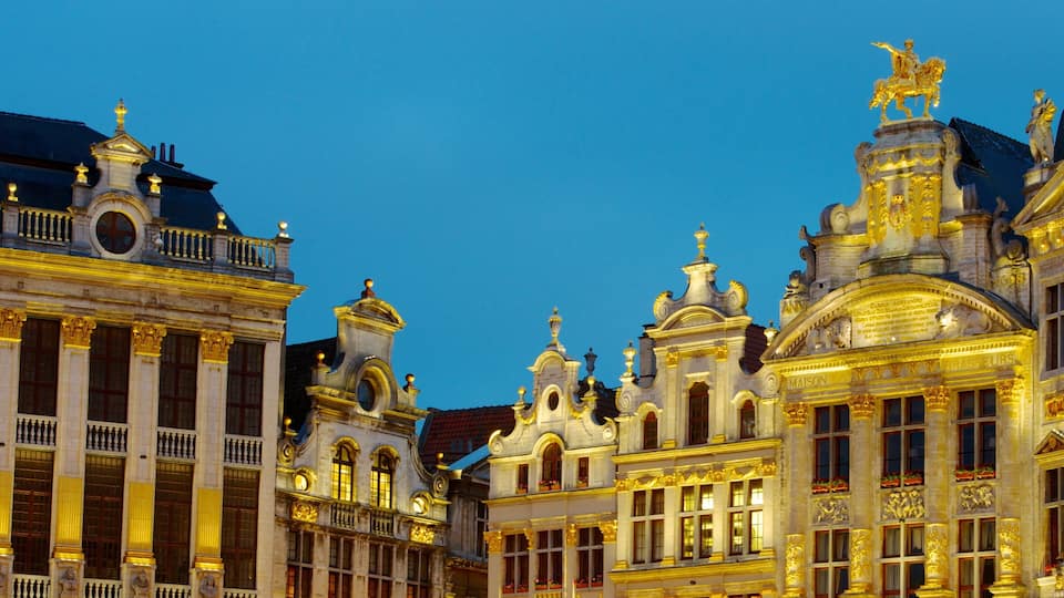 La Grand Place showing a castle, heritage architecture and night scenes