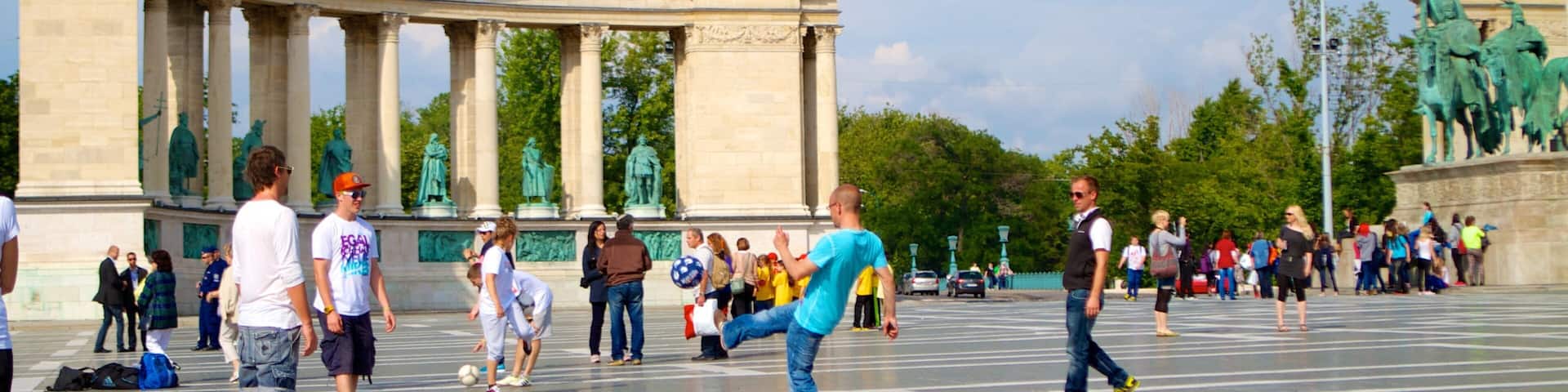 Heroe\\\'s Square which includes a square or plaza as well as a large group of people