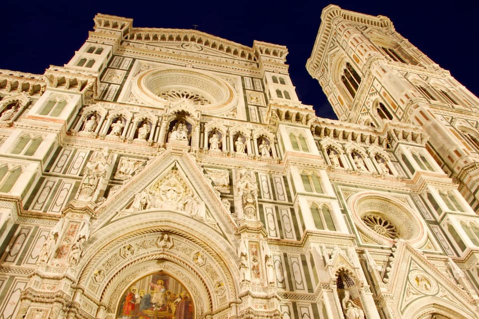 A detailed view of a cathedral's facade with intricate carvings and statues.
