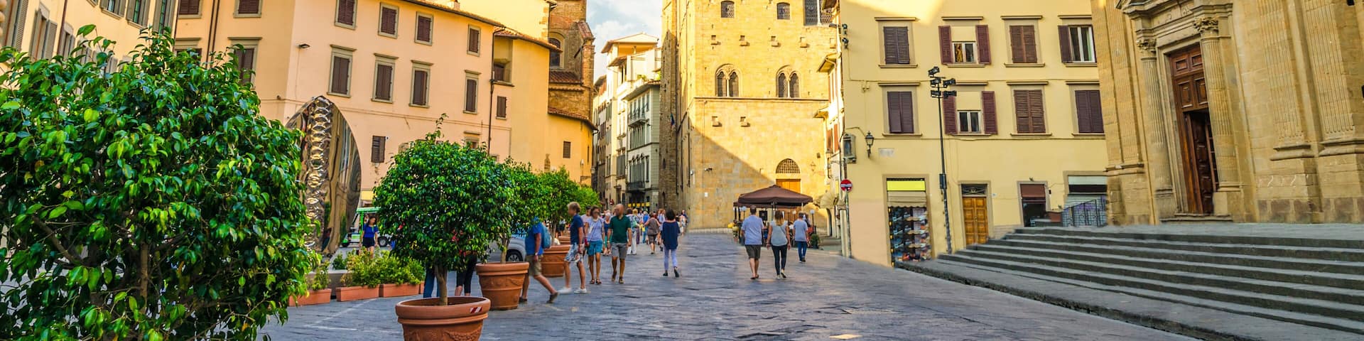 Piazza di San Firenze square with Chiesa San Filippo Neri, Badia Fiorentina Monastero catholic church and Bargello museum in historical centre of Florence city, blue sky white clouds, Tuscany, Italy