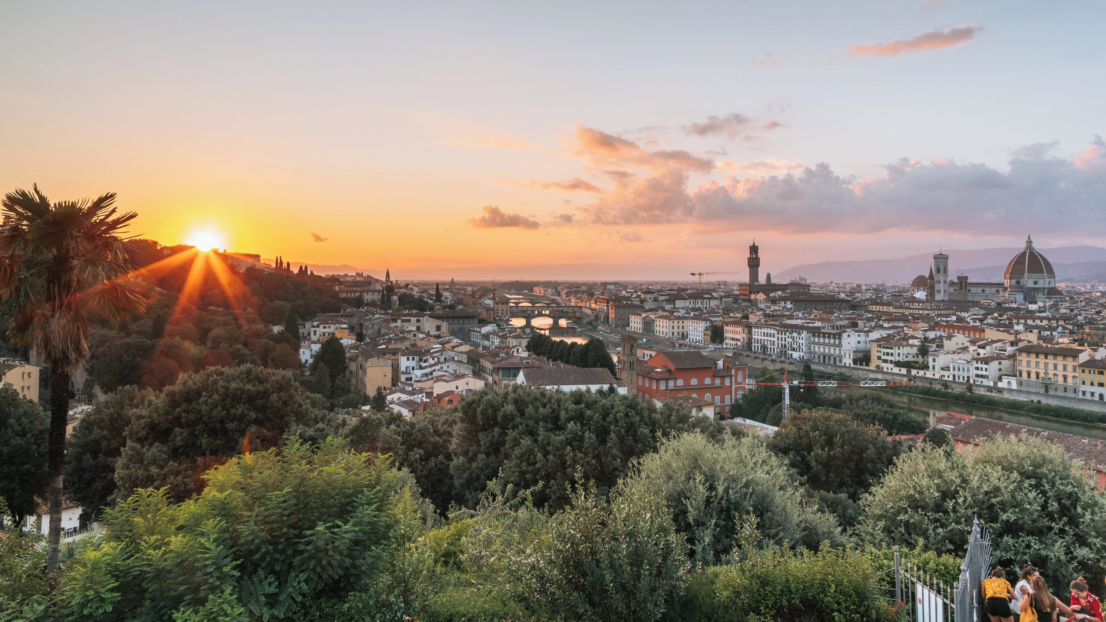 Sunset over Florence from Piazzale Michelangelo showcasing the beauty of Tuscany and the historic skyline of the city