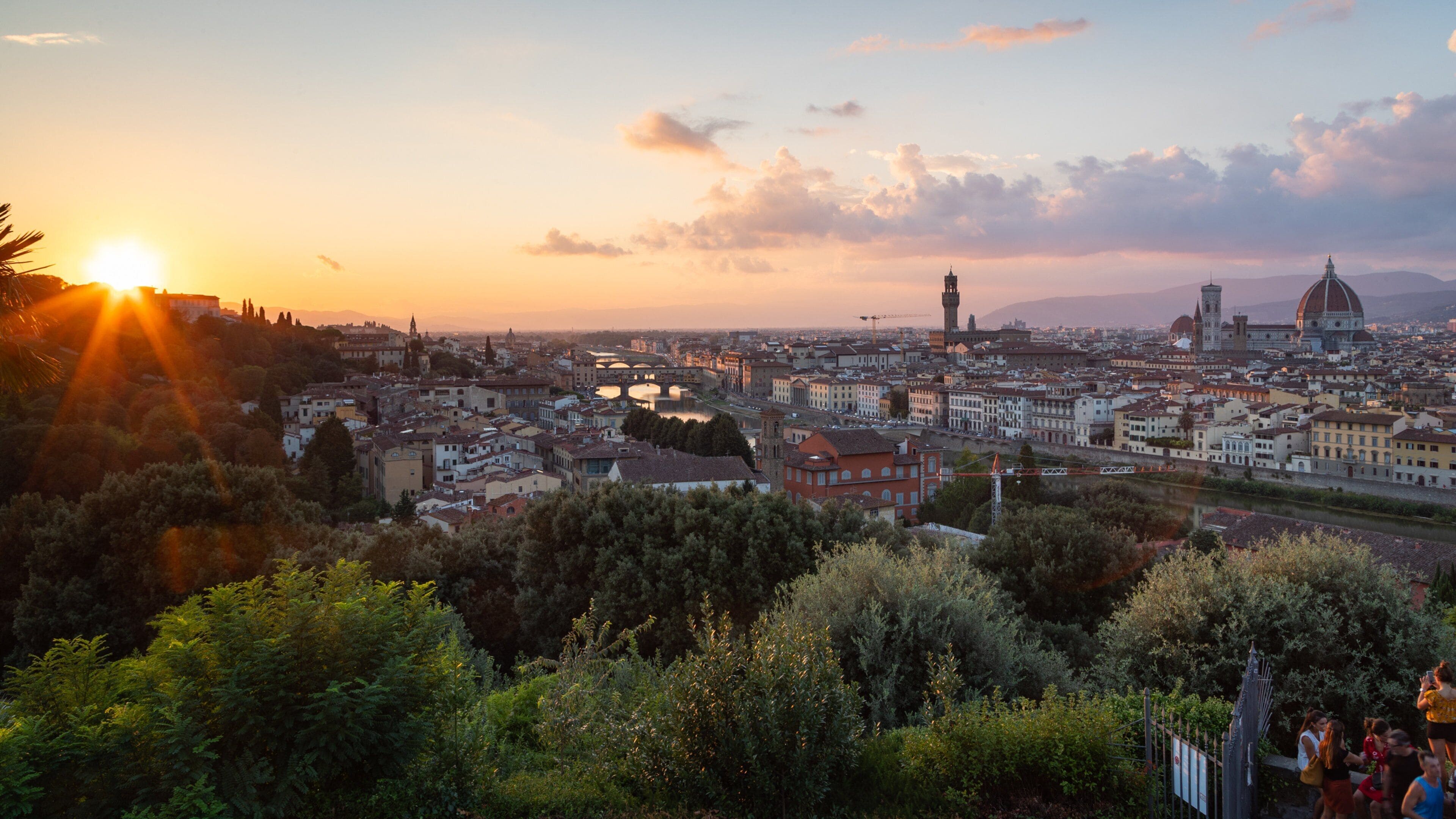 Piazzale Michelangelo showing landscape views, a sunset and a city