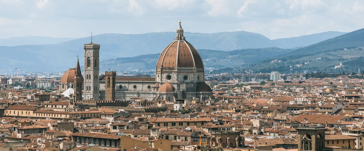 Piazzale Michelangelo showing a city, landscape views and heritage architecture