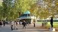 Hyde Park Corner which includes street performance and a garden as well as a small group of people