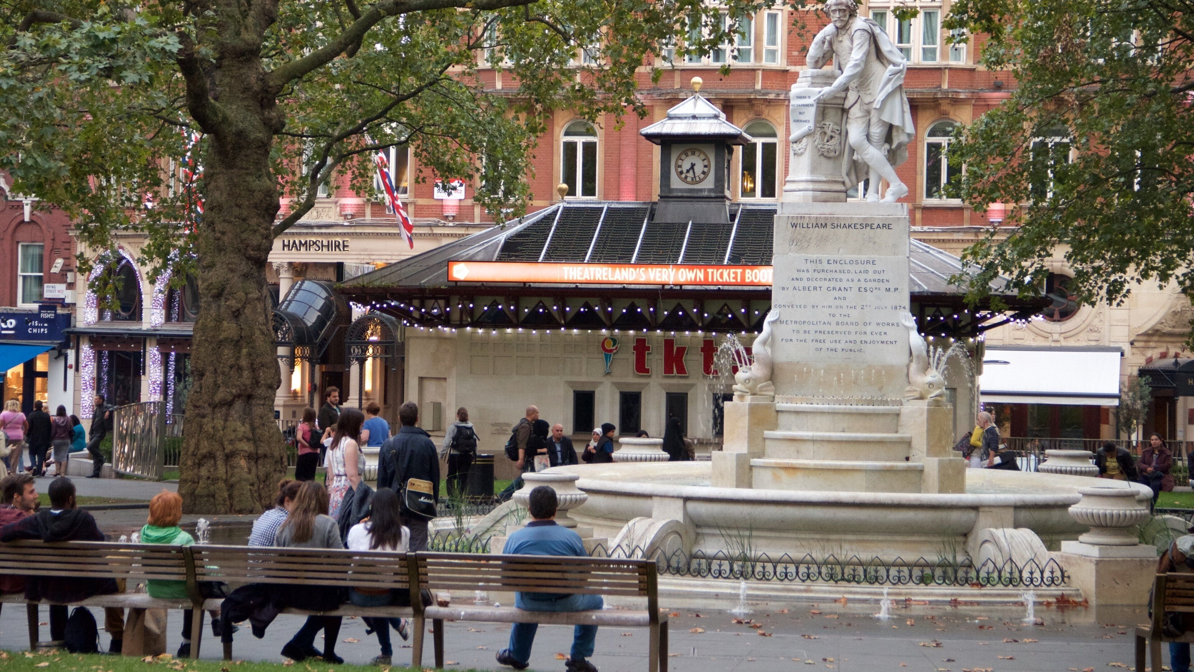 Leicester Square which includes a fountain and a square or plaza