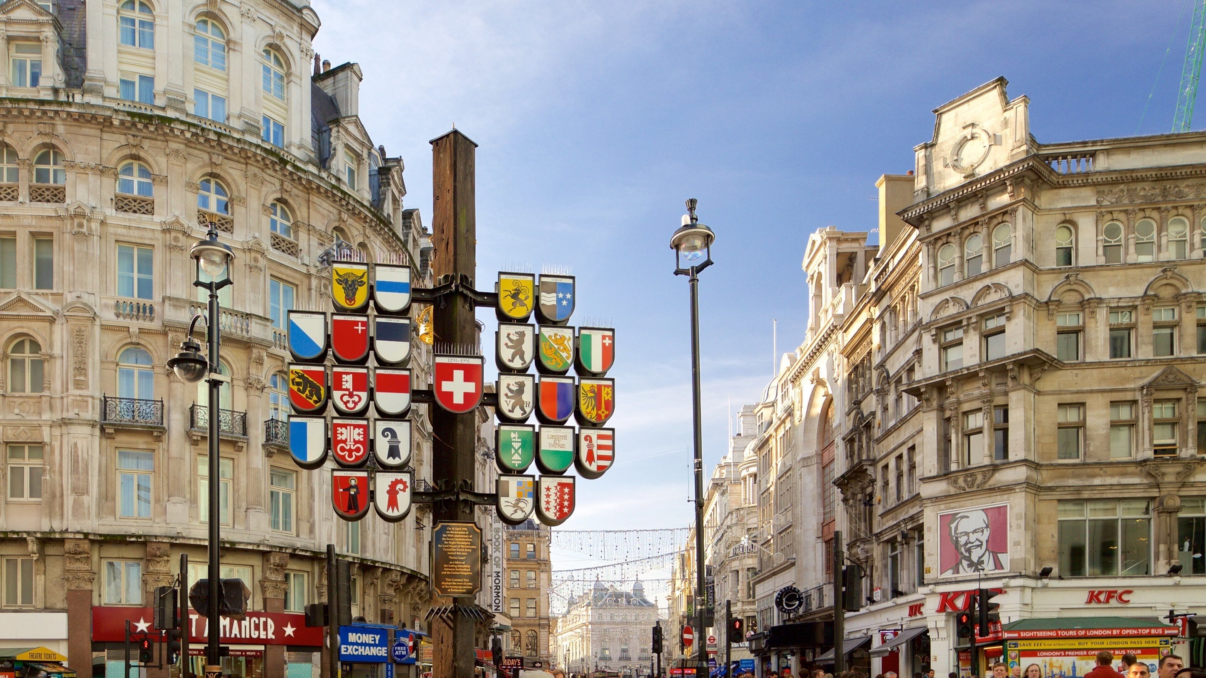 Leicester Square featuring heritage architecture, signage and a city