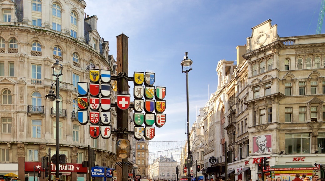 Leicester Square featuring heritage architecture, signage and a city