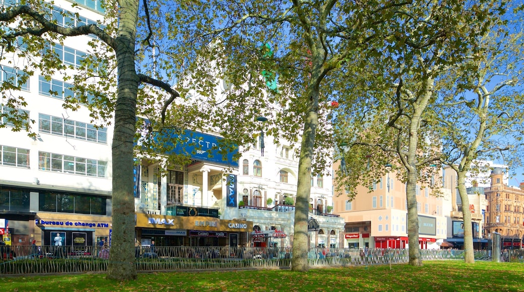 Leicester Square showing a park and a city