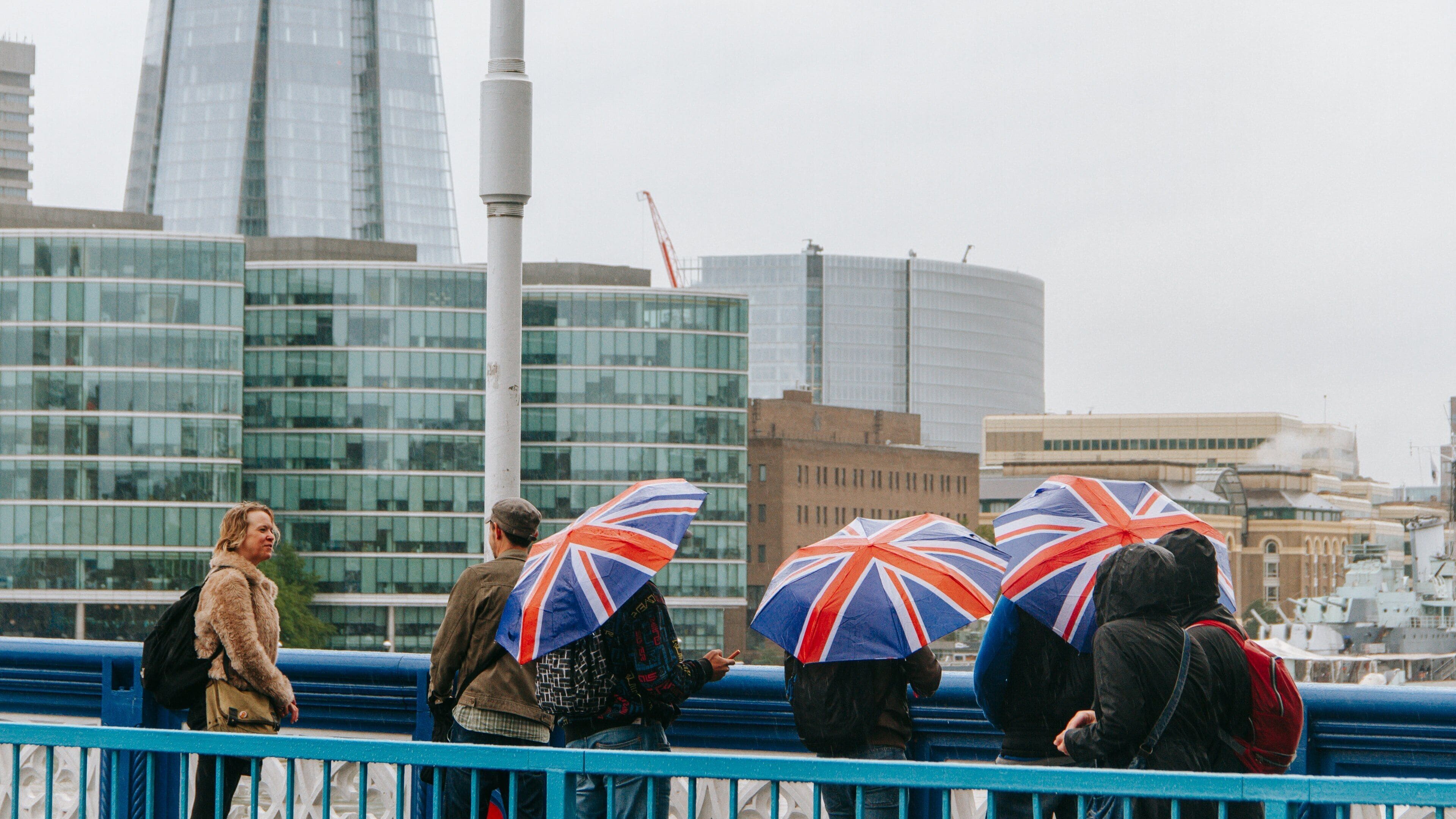 Tower Bridge showing a city and views as well as a small group of people