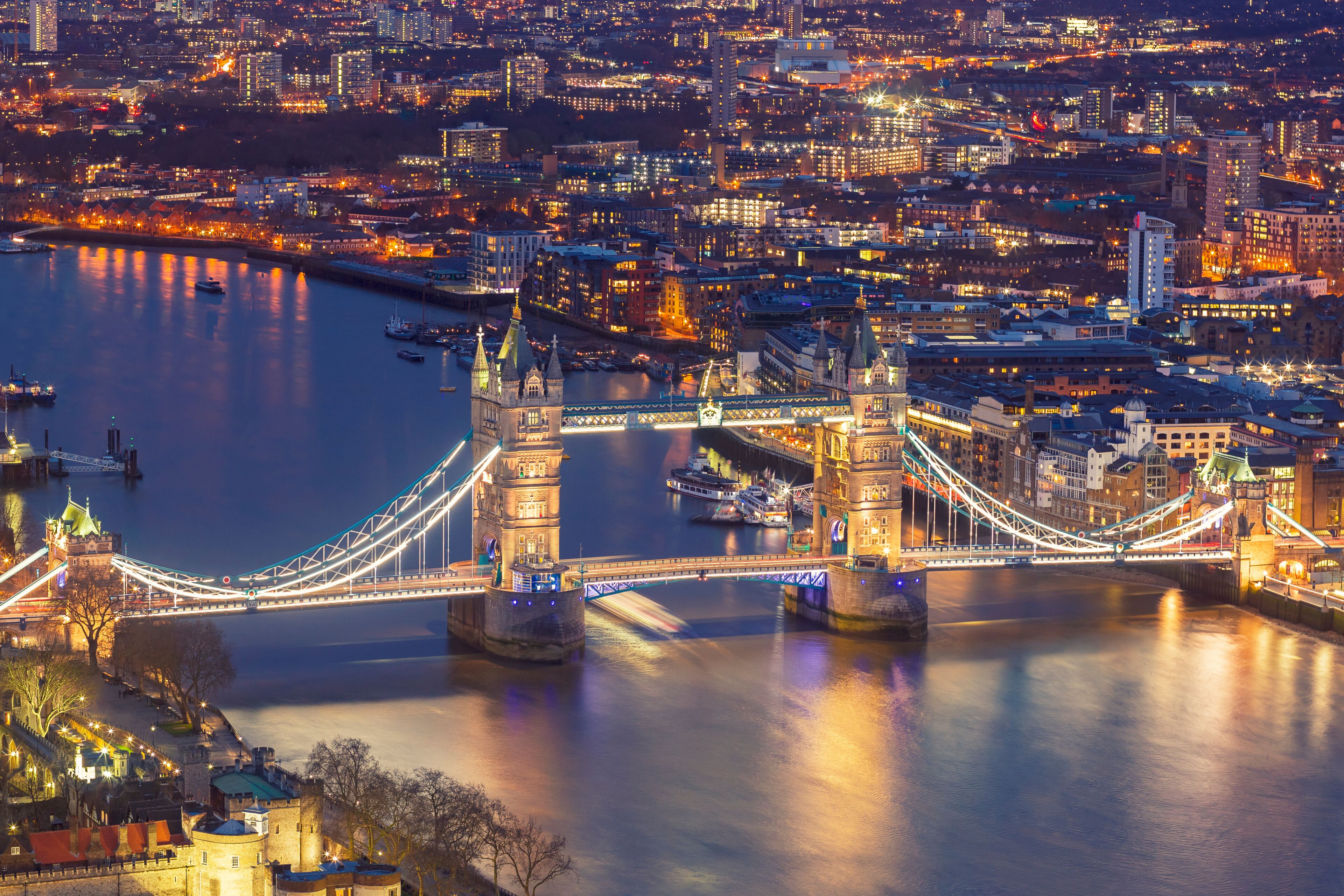 London, England - Iconic Tower Bridge and River Thames aerial view at magic hour