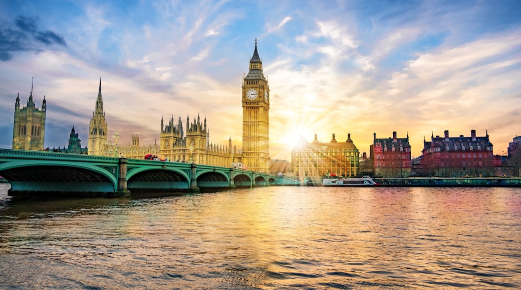 London cityscape with Big Ben and City of Westminster Abbey bridge in sunset light, in United Kingdom of England