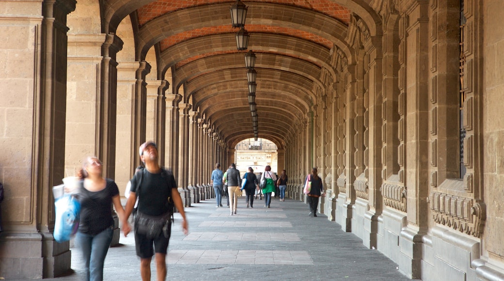 Zócalo which includes heritage architecture as well as a small group of people