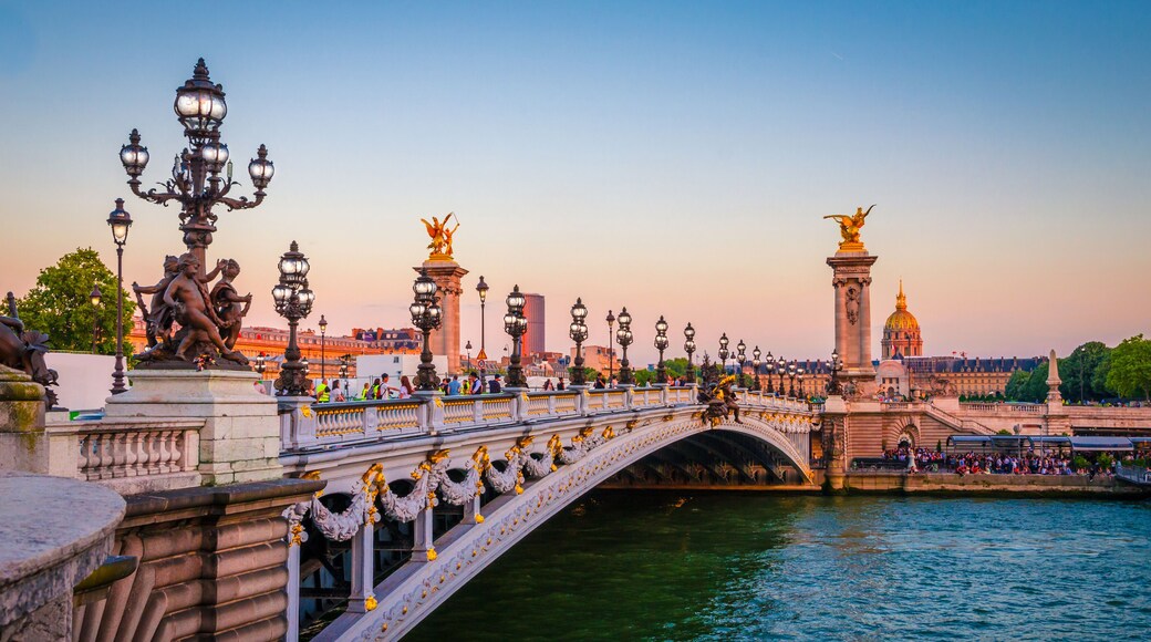 Beautiful sunset view on Pont Alexandre III and Les Invalides in Paris, France