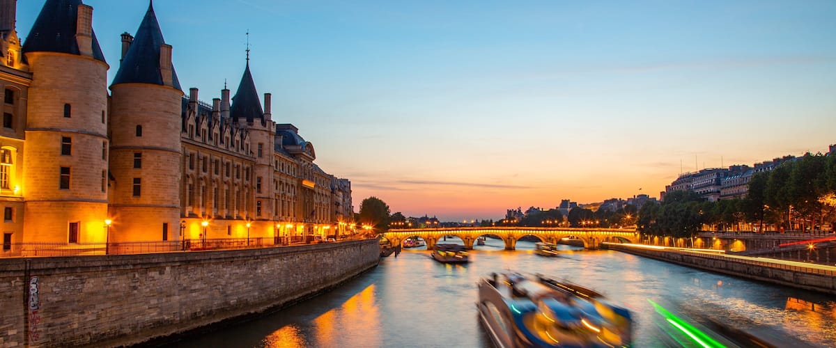 Pont Neuf showing a sunset, a river or creek and night scenes