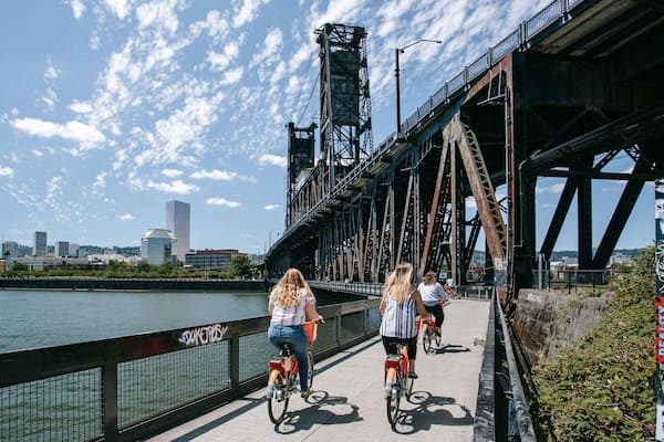 Steel Bridge which includes a bridge, a river or creek and cycling