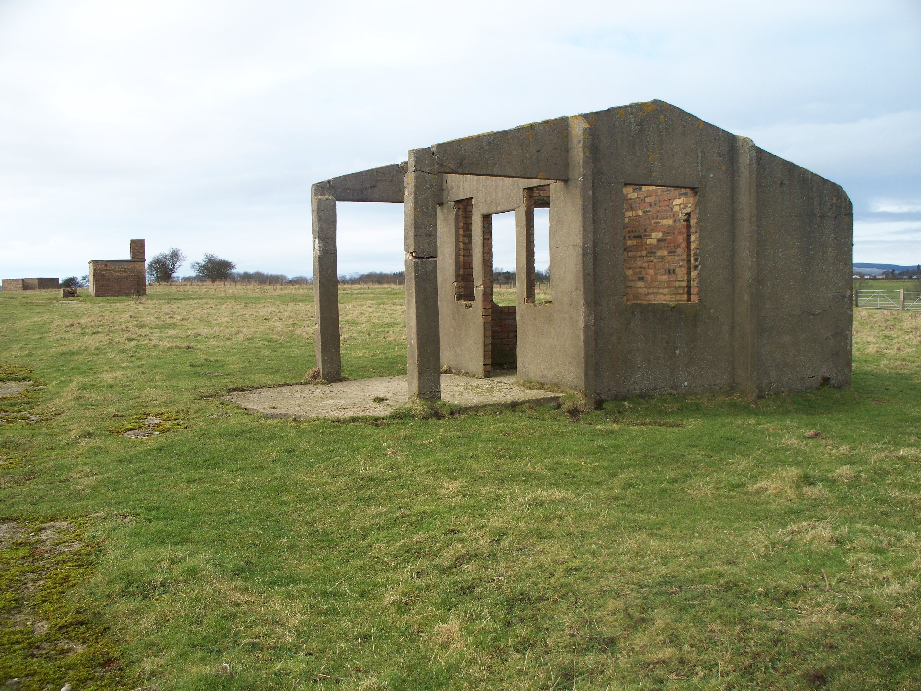 Military buildings On the periphery of the old Eshott Airfield(sometimes called Bockenfield). The location of the three buildings in the photograph can be seen on the aerial photograph provided on this 'disused Airfields' website. http://www.content-delivery.co.uk/aviation/airfields/