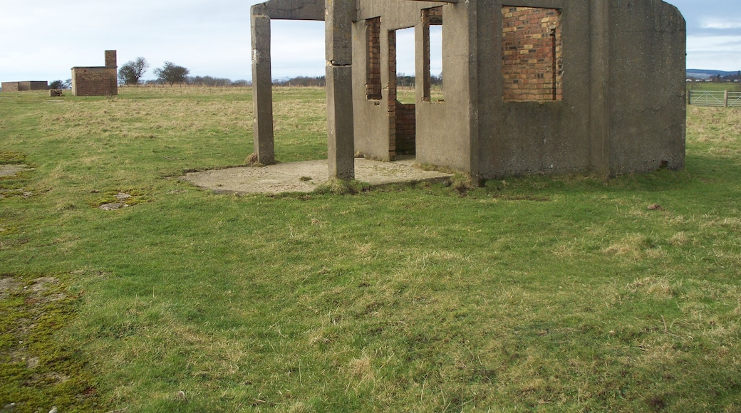 Military buildings On the periphery of the old Eshott Airfield(sometimes called Bockenfield). The location of the three buildings in the photograph can be seen on the aerial photograph provided on this 'disused Airfields' website. http://www.content-delivery.co.uk/aviation/airfields/