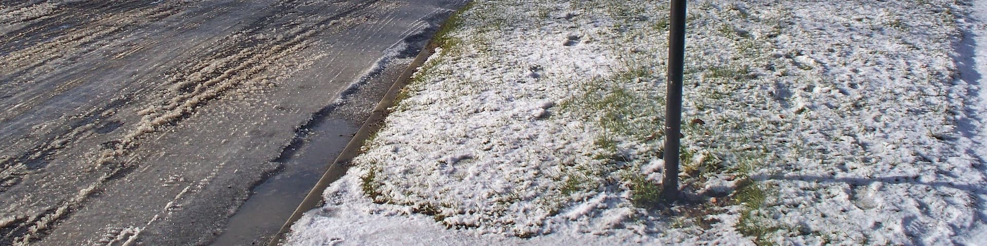 Looking West From near the junction of Rothbury Road into Cheviot Lodge. Villa Lane and West lane cottages can be seen to the left, Simonside under snow in the middle distance and No 1 Cheviot Lodge to the right.