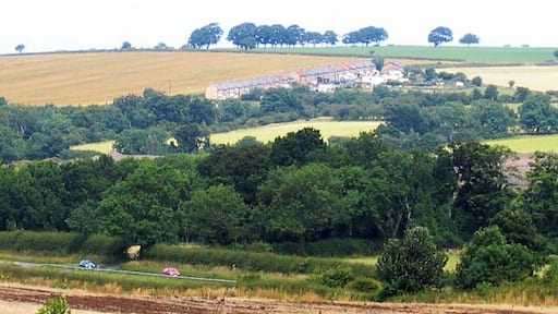 Hazon High Houses. The road in the foreground is the A1. Photograph taken from Newton On The Moor.