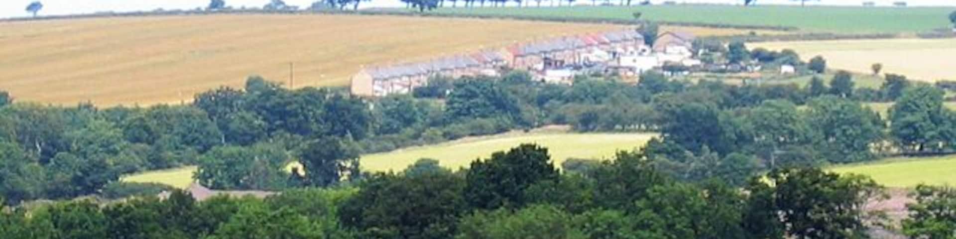 Hazon High Houses. The road in the foreground is the A1. Photograph taken from Newton On The Moor.