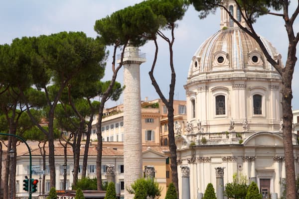 Exploring the architectural beauty of Piazza Venezia in Rome, Lazio, showcasing historical structures and lush greenery
