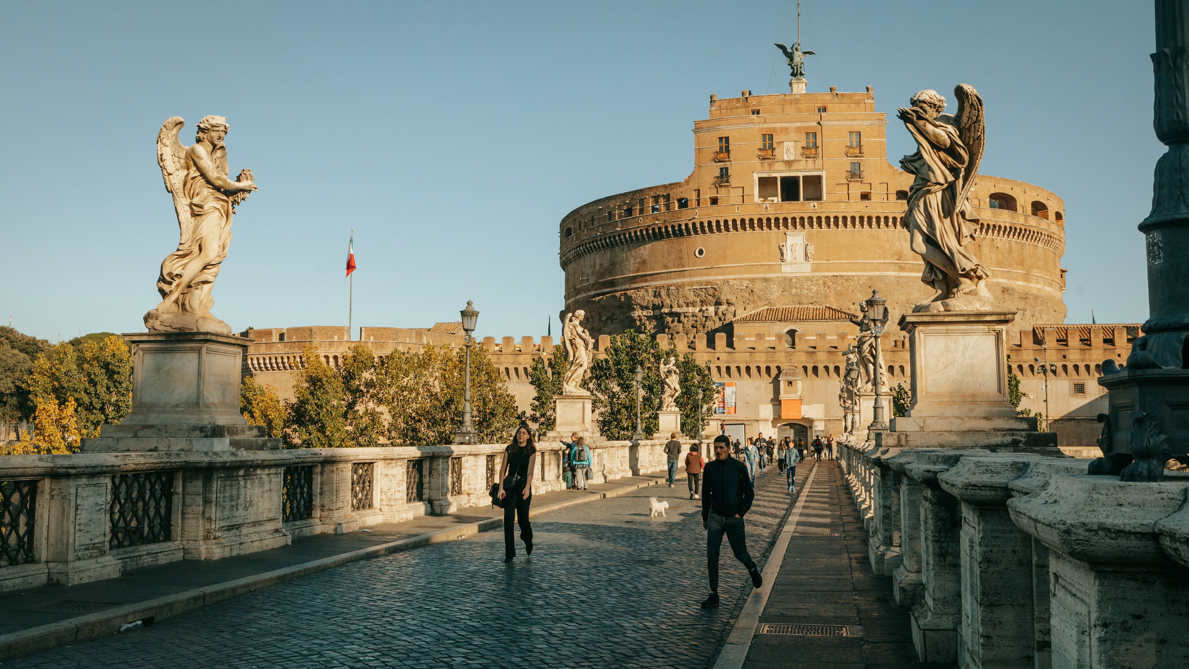 Ponte Sant\'Angelo featuring a statue or sculpture, street scenes and heritage architecture