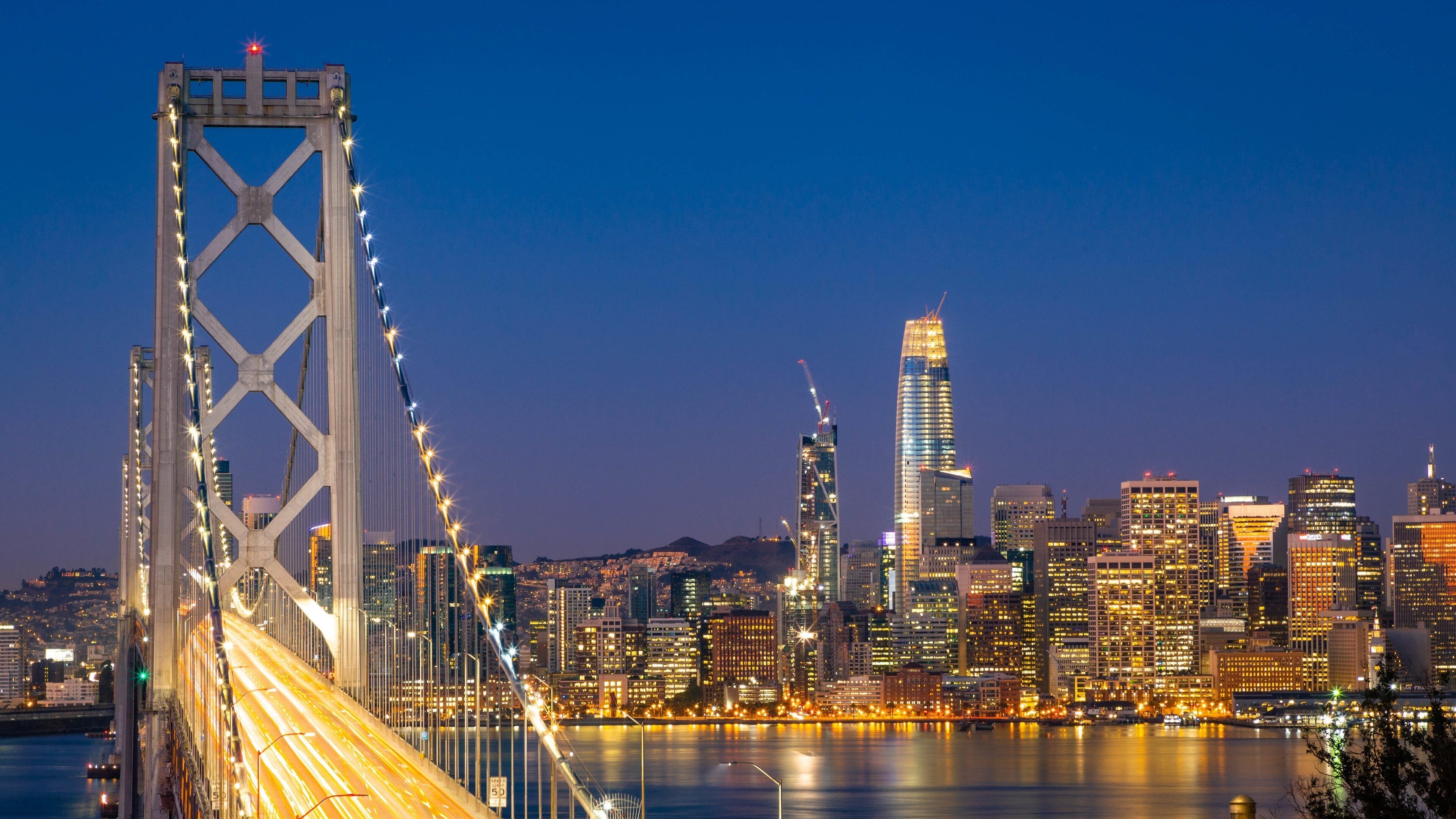 Bay Bridge showing a bridge, a bay or harbor and night scenes
