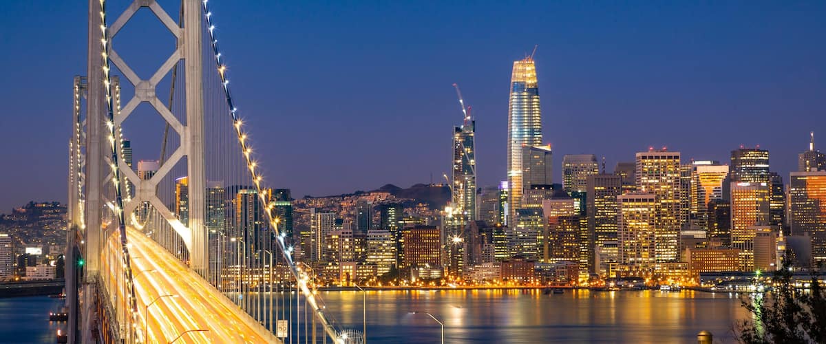 Bay Bridge showing a bridge, a bay or harbor and night scenes